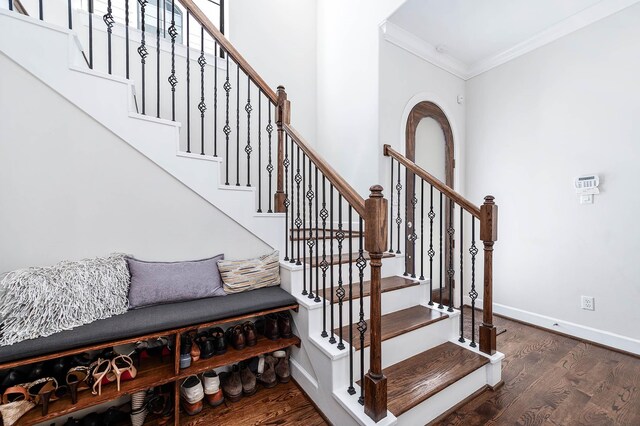 4707 Jackson St, Houston, TX 77004 - staircase with ornamental molding, baseboards, and wood finished floors