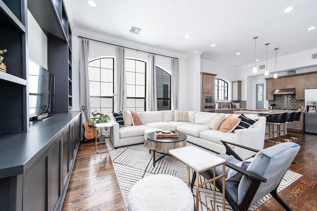 living room featuring ornamental molding, recessed lighting, dark wood-style floors, and visible vents