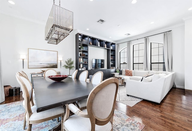 4707 Jackson St, Houston, TX 77004 - dining space with ornamental molding, recessed lighting, wood finished floors, and built in shelves