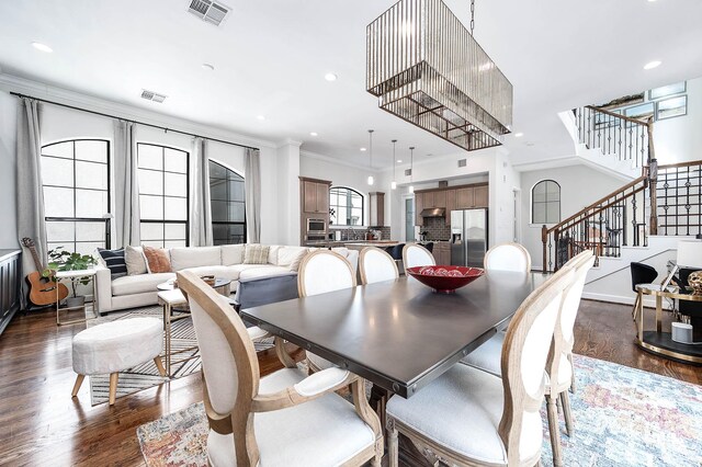 4707 Jackson St, Houston, TX 77004 - dining area featuring dark wood-type flooring, stairway, recessed lighting, crown molding, and baseboards