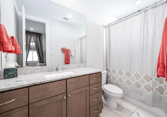 4707 Jackson St, Houston, TX 77004 - full bathroom featuring vanity, toilet, tile patterned flooring, a shower with shower curtain, and recessed lighting