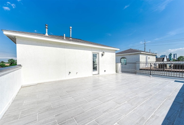 back of property featuring a patio and stucco siding