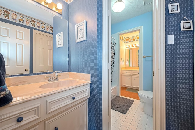 bathroom featuring vanity, toilet, tile patterned floors, a textured ceiling, and a shower with shower curtain