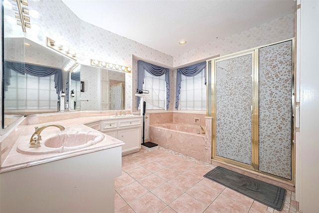 full bathroom featuring tile patterned flooring, vanity, wallpapered walls, a bath, and a stall shower