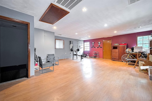 workout area with visible vents, recessed lighting, and a wealth of natural light
