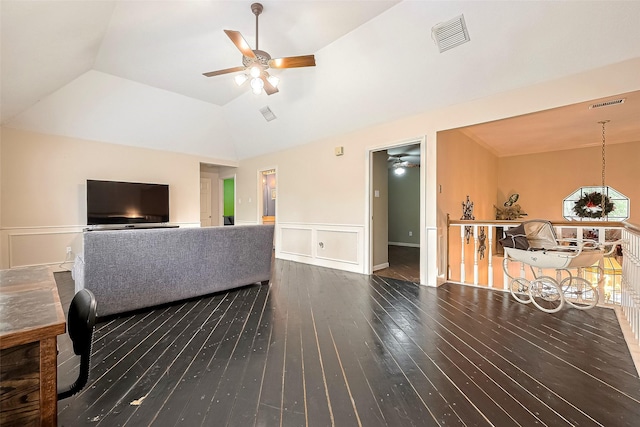 living room featuring ceiling fan, hardwood / wood-style flooring, visible vents, and lofted ceiling