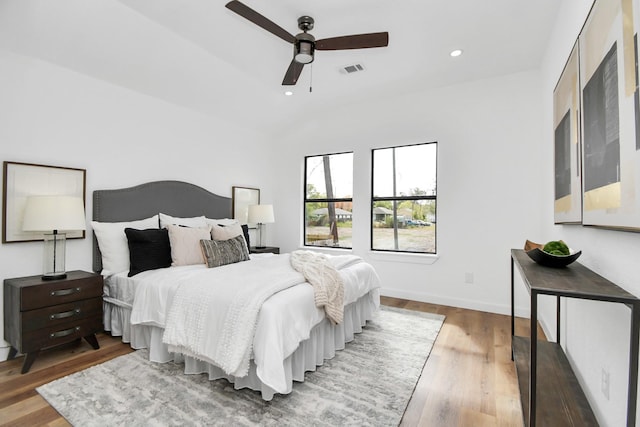 bedroom featuring recessed lighting, a ceiling fan, visible vents, and wood finished floors