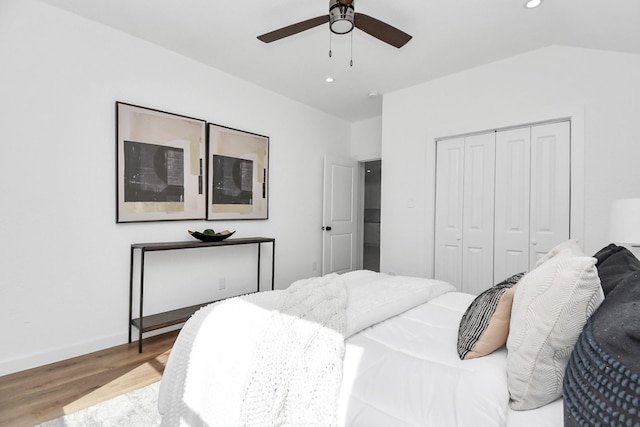 bedroom with a closet, recessed lighting, a ceiling fan, and wood finished floors
