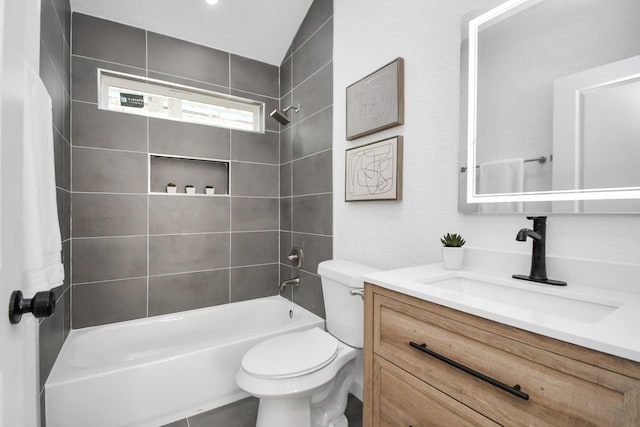 bathroom featuring shower / bath combination, vanity, and toilet