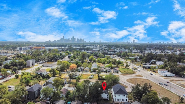 birds eye view of property featuring a city view