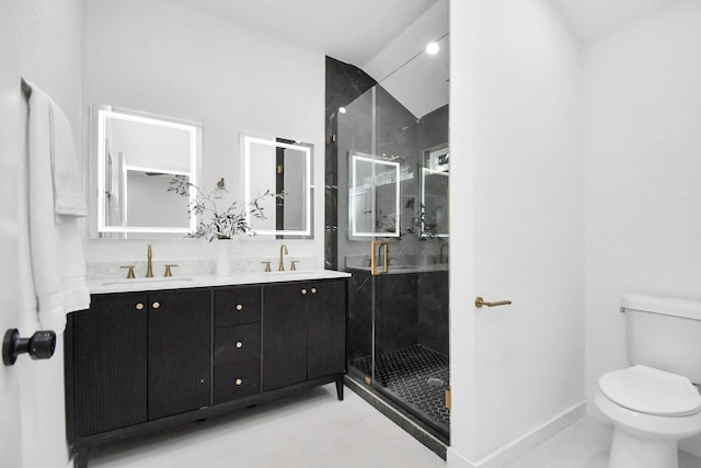 full bathroom with double vanity, toilet, a shower stall, and a sink