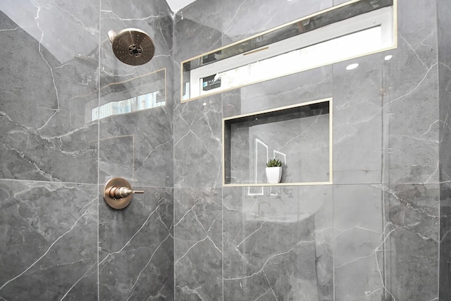 full bath featuring tiled shower