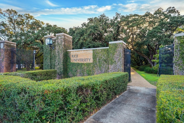 community sign featuring fence