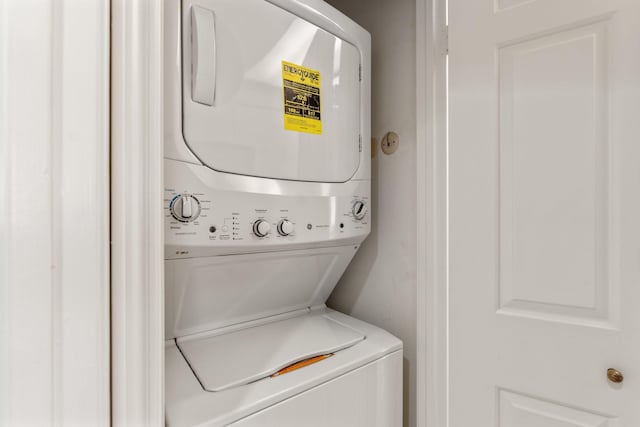 laundry area with laundry area and stacked washer and clothes dryer