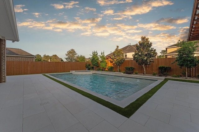 view of swimming pool featuring a fenced backyard, a fenced in pool, an in ground hot tub, and a patio area