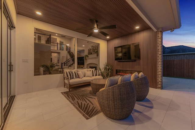 view of patio / terrace featuring ceiling fan, outdoor lounge area, and fence