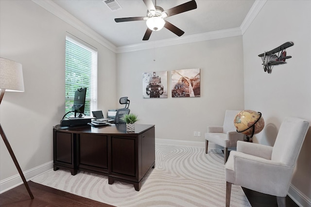 office featuring crown molding, a ceiling fan, baseboards, and visible vents