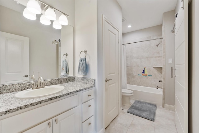 full bath featuring toilet, washtub / shower combination, tile patterned flooring, and vanity