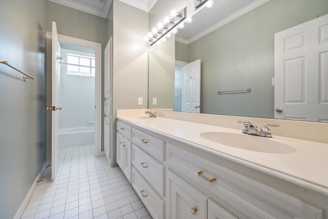 full bath with double vanity, tile patterned flooring, a sink, baseboards, and ornamental molding