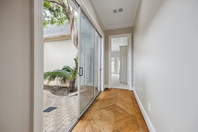 corridor with baseboards and visible vents