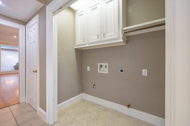 laundry area featuring washer hookup, hookup for a gas dryer, baseboards, light tile patterned floors, and hookup for an electric dryer