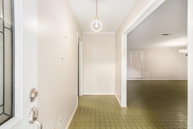 hall featuring crown molding, visible vents, baseboards, tile patterned floors, and a notable chandelier