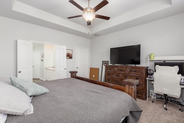15727 Ty Cobb Ct, Splendora, TX 77372 - bedroom with visible vents, ensuite bathroom, ceiling fan, a raised ceiling, and carpet
