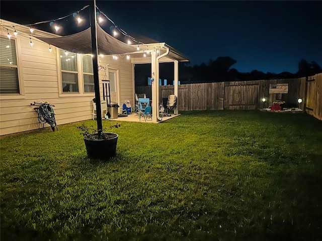 15727 Ty Cobb Ct, Splendora, TX 77372 - yard at twilight featuring a fenced backyard and a patio area