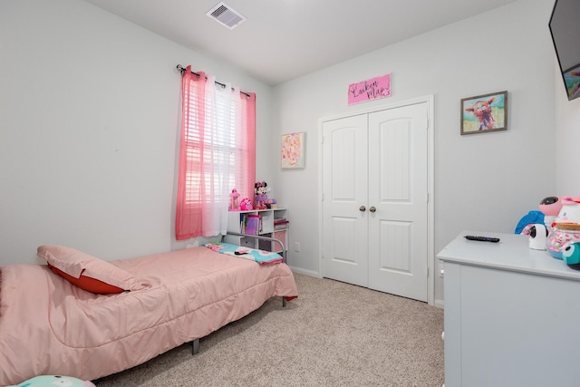 15727 Ty Cobb Ct, Splendora, TX 77372 - bedroom with a closet, baseboards, light colored carpet, and visible vents