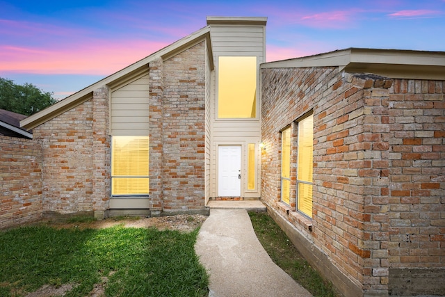 view of front of home with brick siding