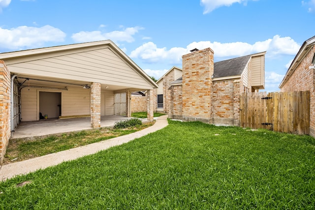 view of yard featuring fence and a patio area