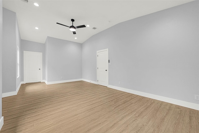 empty room with baseboards, ceiling fan, recessed lighting, light wood-style flooring, and vaulted ceiling