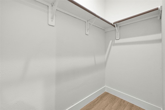 walk in closet featuring light wood-type flooring