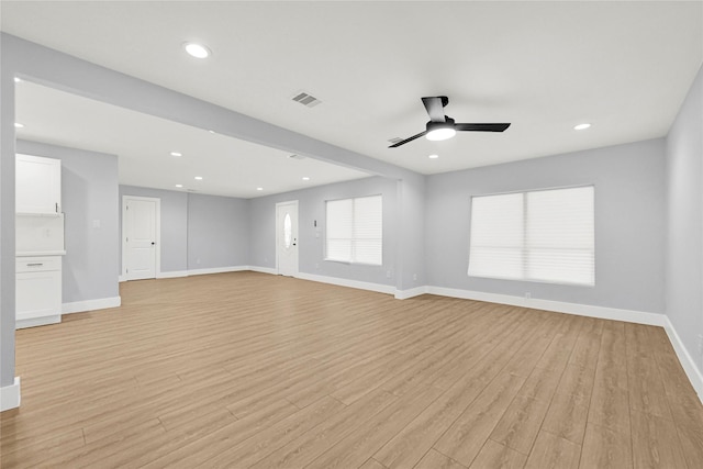 unfurnished living room with ceiling fan, light wood-style floors, recessed lighting, baseboards, and visible vents