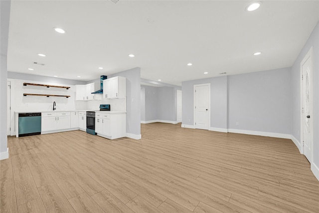 unfurnished living room with recessed lighting, baseboards, light wood finished floors, and visible vents