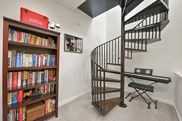 stairs with baseboards and carpet