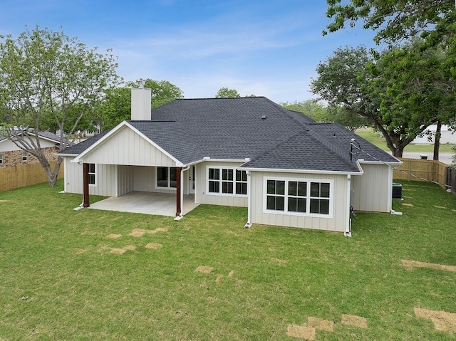 102 Tekla St, Weimar, TX 78962 - back of property with fence, a patio, a chimney, and a yard