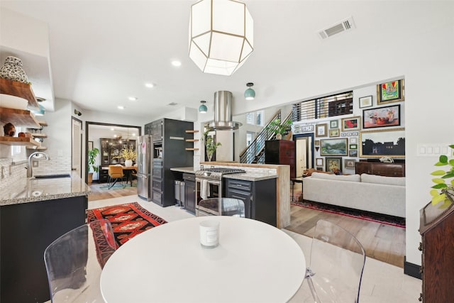 dining room featuring recessed lighting, visible vents, and light wood-style floors