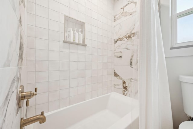 bathroom with shower / bath combo and toilet