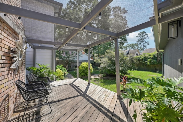 wooden terrace featuring a fenced backyard