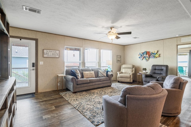 620 Lagoon Dr, Point Blank, TX 77364 - living room with ceiling fan, visible vents, and dark wood finished floors
