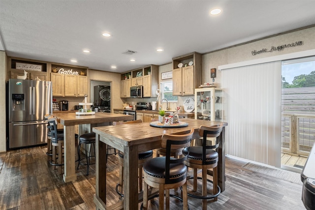 620 Lagoon Dr, Point Blank, TX 77364 - kitchen with wooden counters, visible vents, appliances with stainless steel finishes, dark wood-type flooring, and a wealth of natural light