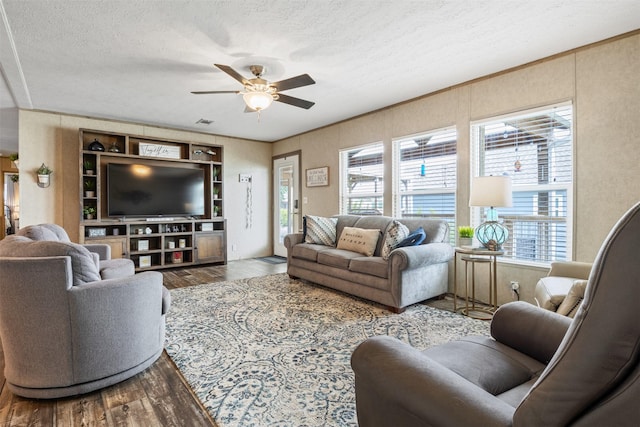 620 Lagoon Dr, Point Blank, TX 77364 - living area featuring a ceiling fan, a textured ceiling, a wealth of natural light, and wood finished floors