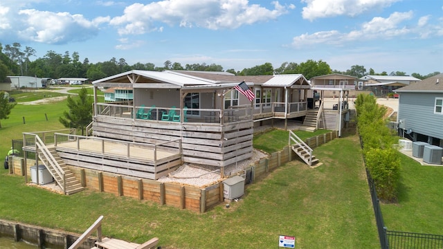 620 Lagoon Dr, Point Blank, TX 77364 - back of house with stairway, a lawn, cooling unit, and a wooden deck
