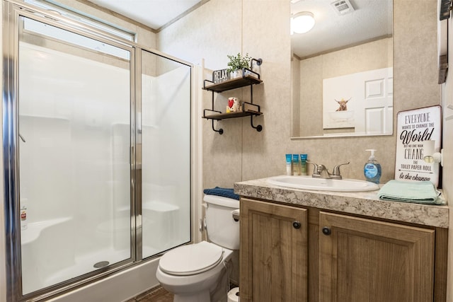 620 Lagoon Dr, Point Blank, TX 77364 - bathroom featuring visible vents, vanity, toilet, and a shower stall