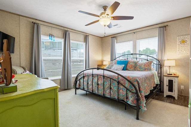 620 Lagoon Dr, Point Blank, TX 77364 - bedroom featuring crown molding, a ceiling fan, visible vents, and multiple windows