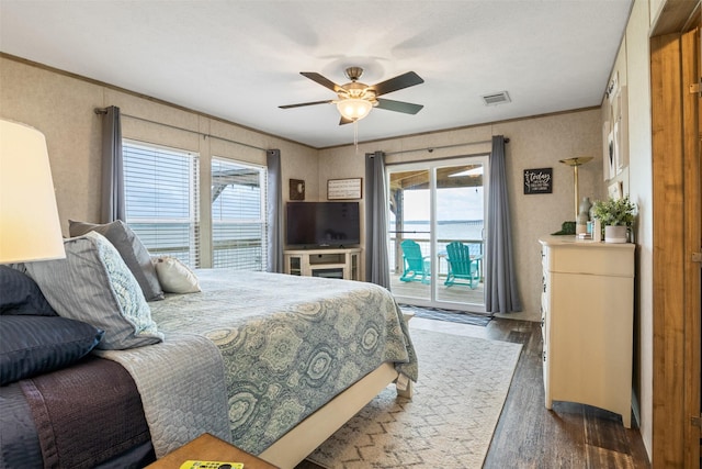 620 Lagoon Dr, Point Blank, TX 77364 - bedroom featuring access to outside, ornamental molding, wood finished floors, and multiple windows