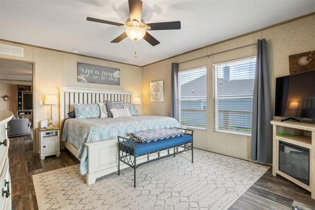 620 Lagoon Dr, Point Blank, TX 77364 - bedroom with ceiling fan, ornamental molding, wood finished floors, and visible vents