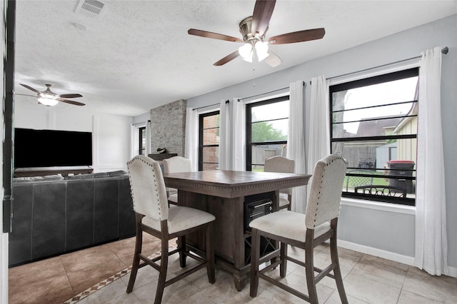 21426 Park York Dr, Katy, TX 77450 - dining area featuring visible vents, a ceiling fan, a textured ceiling, and light tile patterned floors
