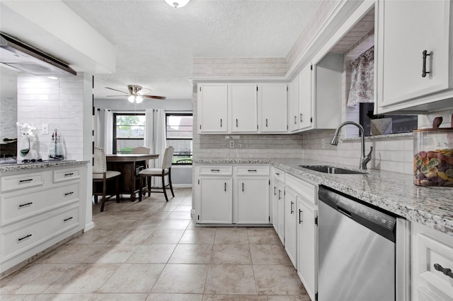 21426 Park York Dr, Katy, TX 77450 - kitchen with a sink, dishwasher, a textured ceiling, a ceiling fan, and backsplash